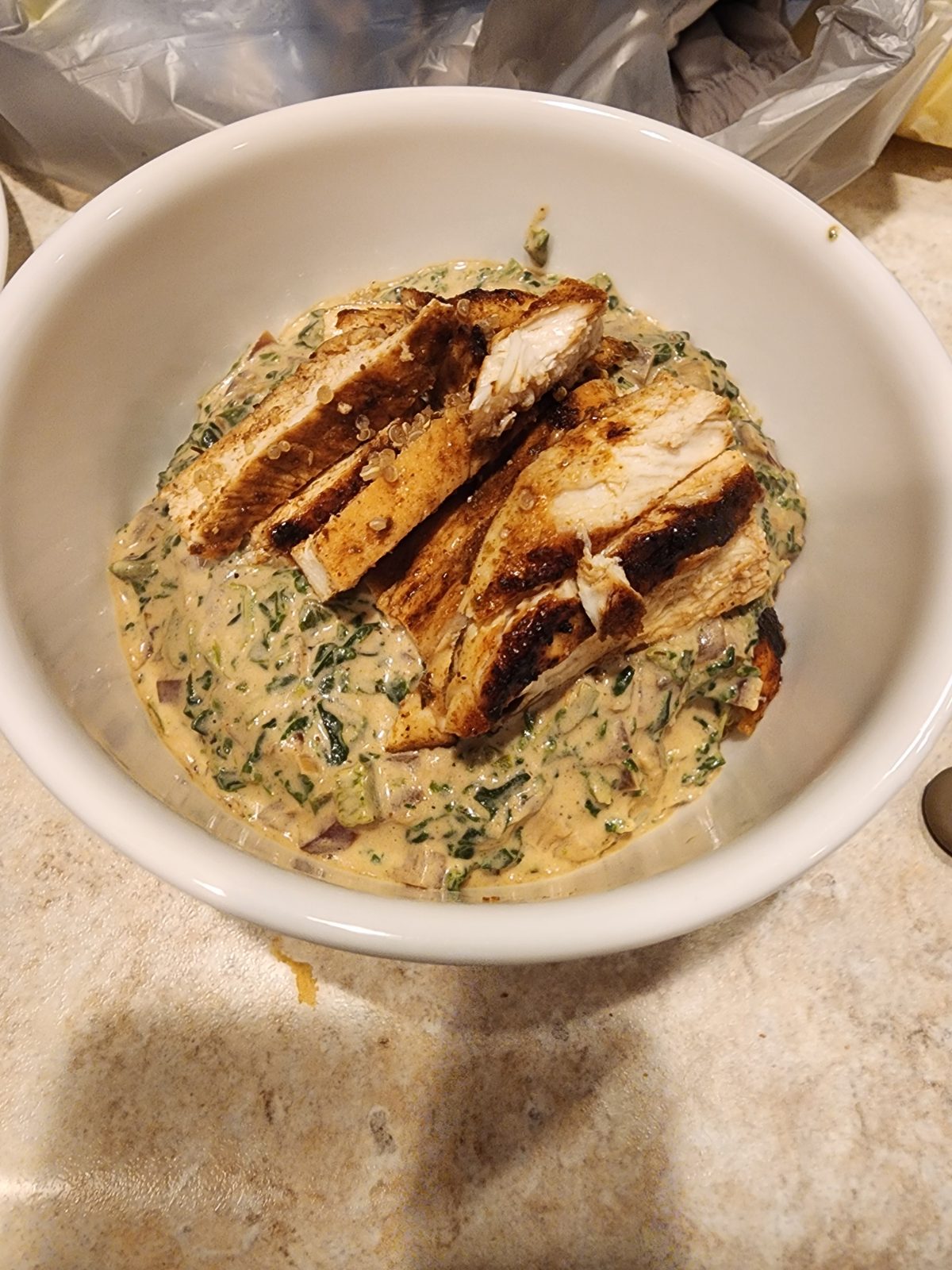 Blackened Chicken over Spinach and Blue Cheese Quinoa